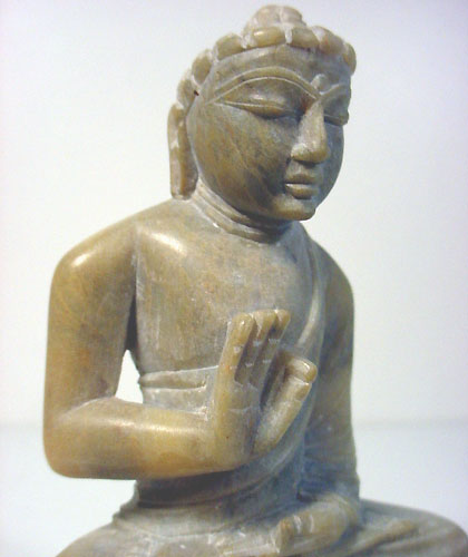 Buddha handcarved from marble stone into buddha statue gesture of protection