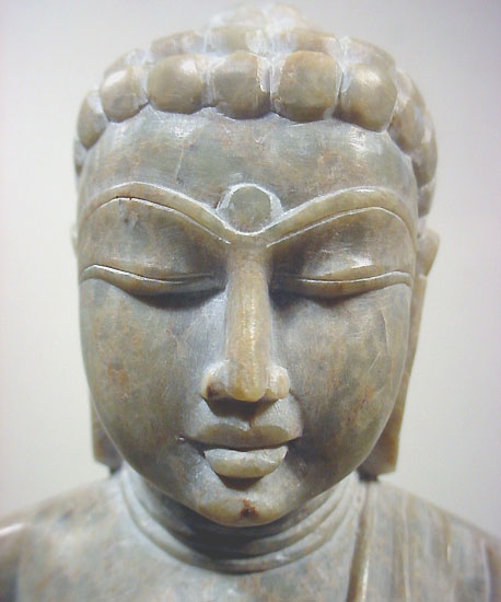 stone buddha carving statue in rock statuette of Budda
